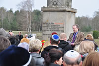 Rosensaft speaking at Bergen-Belsen Concentration Camp in April