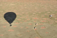 Shadow cast by balloon on fairy circles. Note the tracking vehicles.