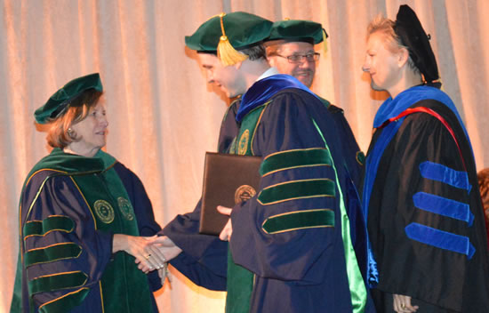 Ellen Futter, President, AMNH congratulates doctoral graduate 
