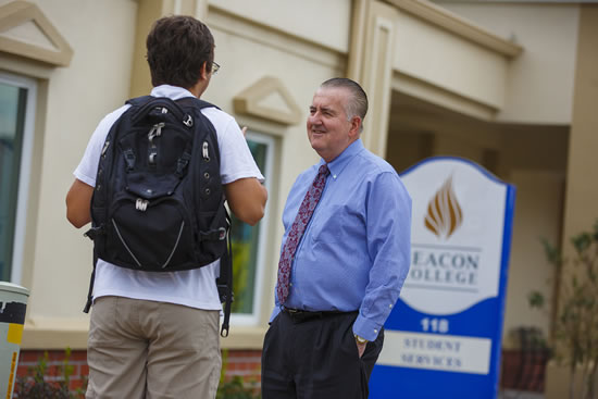 Dr. George Hagerty chats with Beacon College student Nevin Yadav